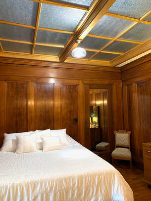 North Loft Bedroom with mahogany paneling