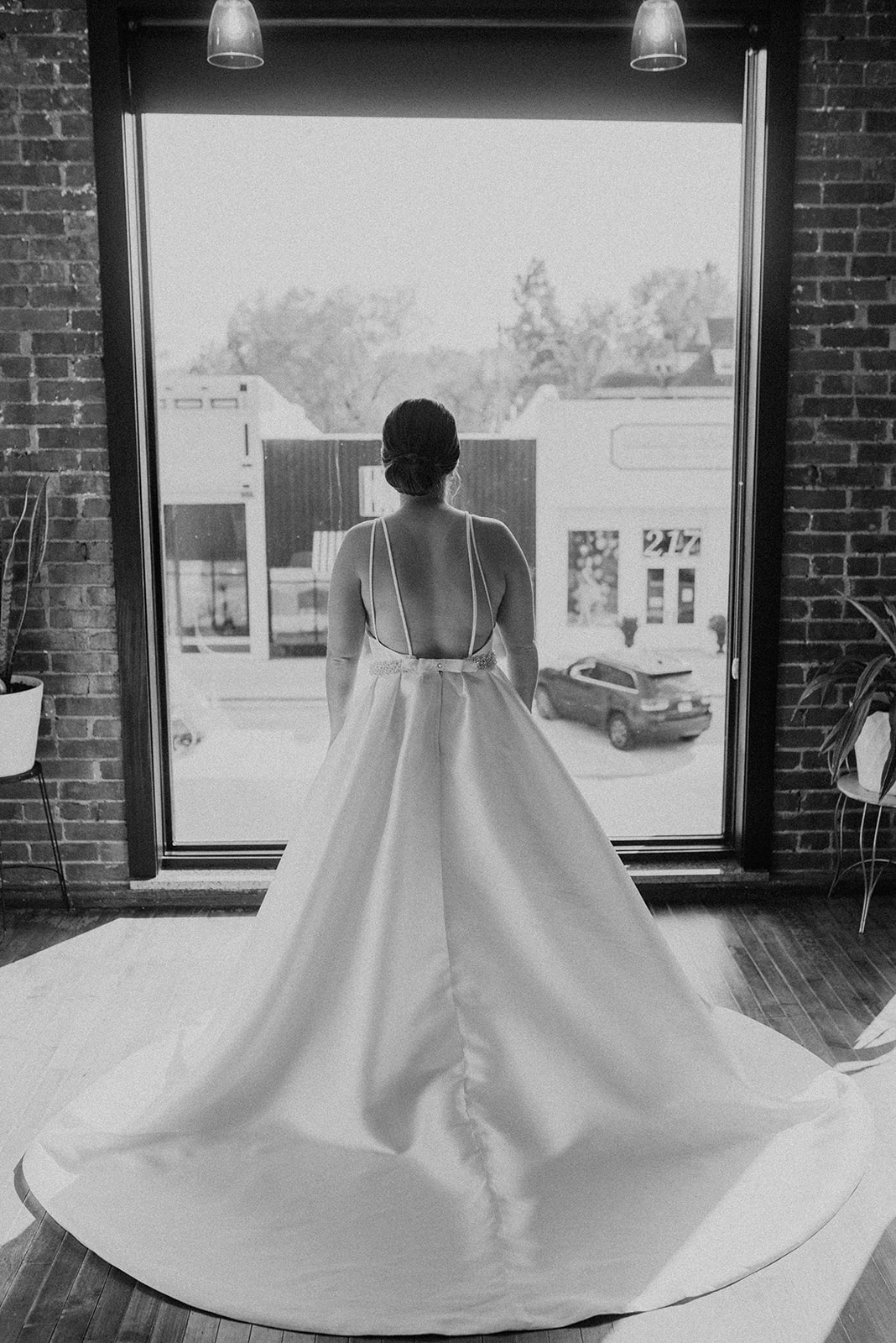 Bride standing in the front window